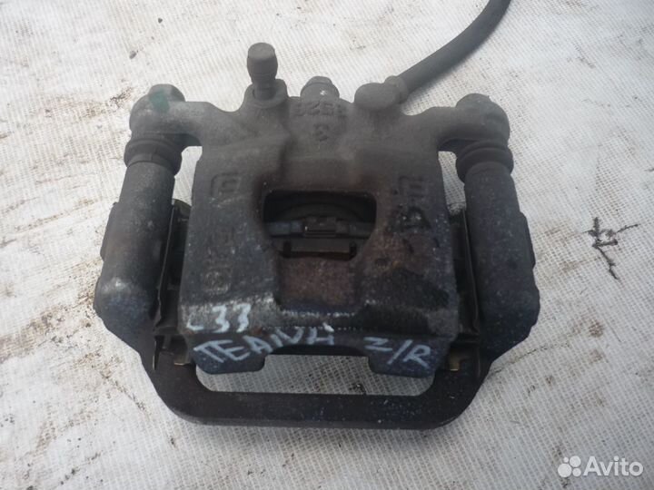 Суппорт тормозной задний LH/RH Nissan Teana L33