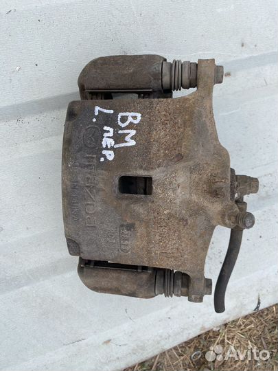 Суппорт тормозной передний левый mazda 3 bm