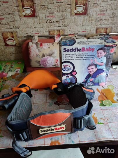 Переноска детей на плечах, новая