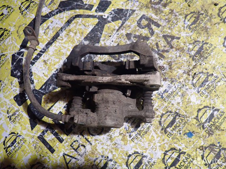 Суппорт тормозной задний левый Subaru Impreza g12