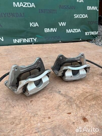 Суппорт тормозной передний Kia K5 DL3 2.5 G4KN