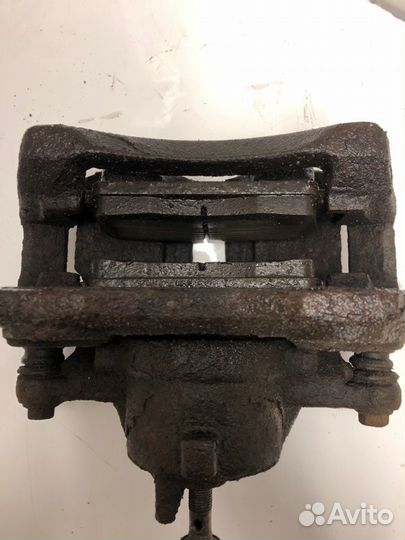 Суппорт тормозной передний левый Nissan Almera N16