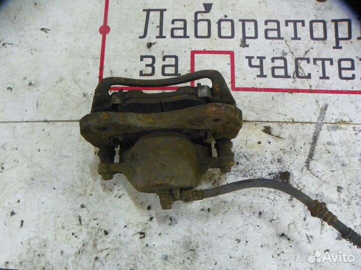 Суппорт тормозной передний левый Hyundai Tucson