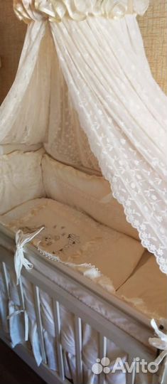 Детская кроватка с продольным маятником