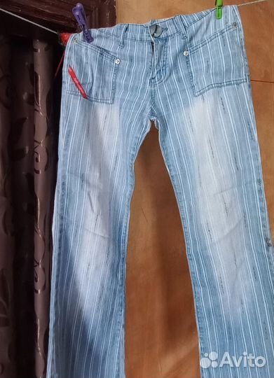 Джинсы клеш