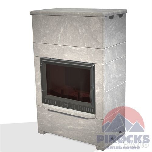 Чугунный камин в облицовке из камня