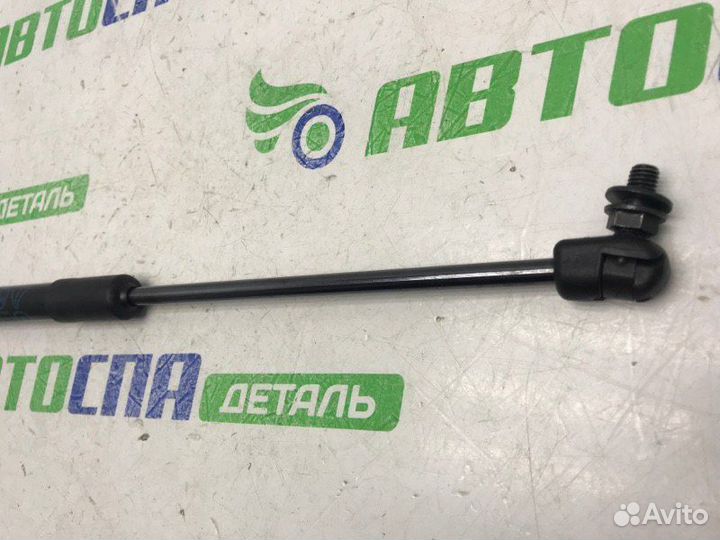 Амортизатор крышки багажника задний левый Mazda