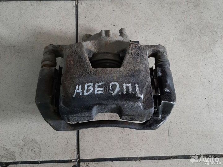 Тормозной суппорт передний левый Chevrolet Авео Т3
