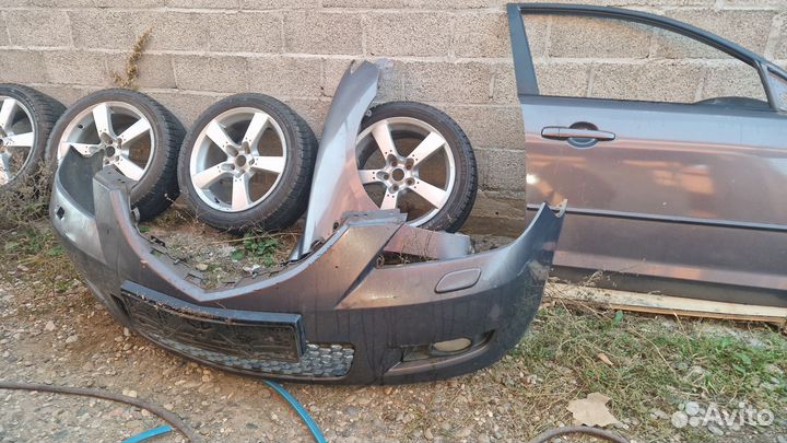 Передний бампер мазда 3 бк седан 2006 год