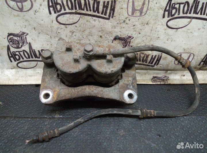 Суппорт передний левый Mitsubishi Pajero 4 6G72