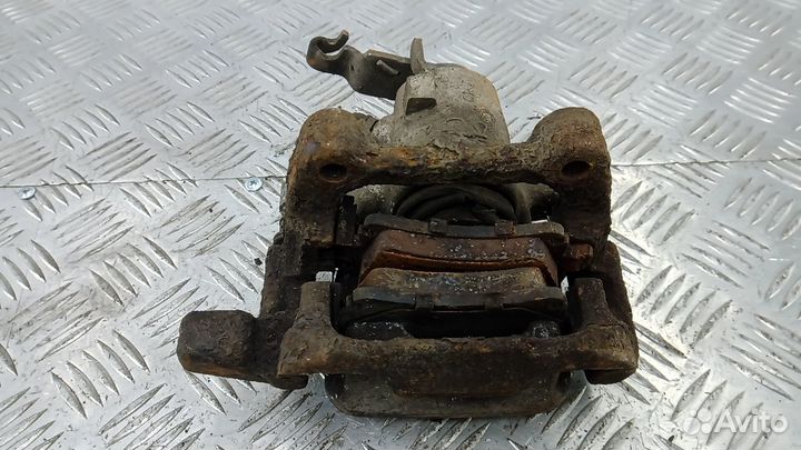 Суппорт тормозной задний левый Skoda Octavia