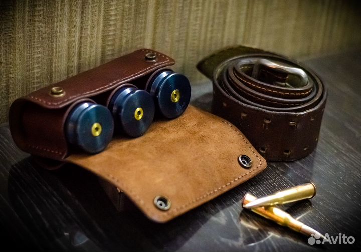 Стопки из гильз 2А42 в кожаном патронташе