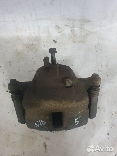 Суппорт тормозной передний левый Nissan Almera N16