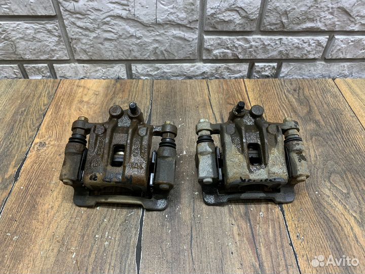 Kia Sportage Суппорт тормозной задний LH RH