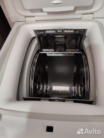 Стиральная машинка с вертикальной загрузкой Candy