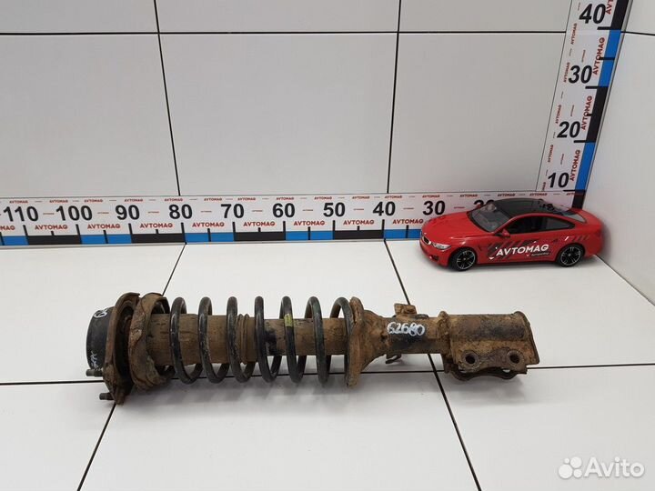 Амортизатор передний левый с пружиной (Kia Rio)