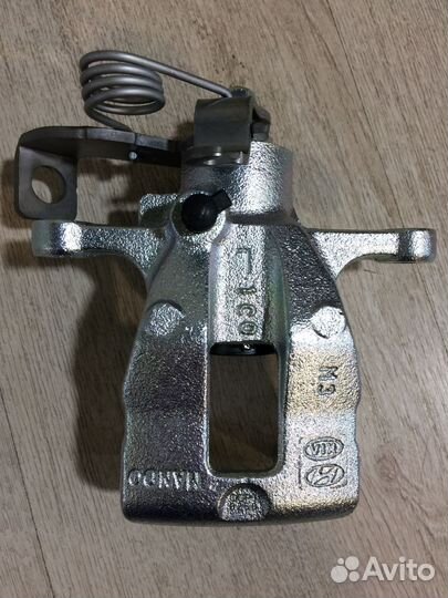 Суппорт задний левый оригинал новый Солярис Рио 3