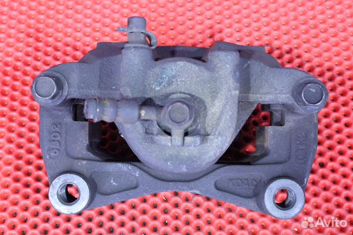 Суппорт тормозной передний левый Nissan Teana J31