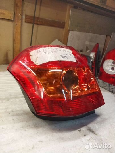 Фонарь левый Corolla 120 хетч Koito 13-87