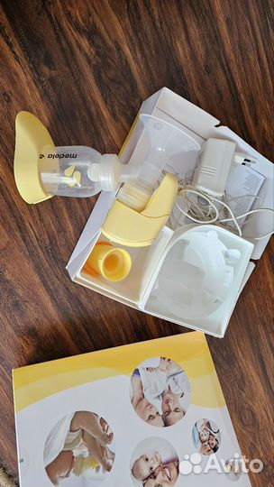 Молокоотсос medela электрический
