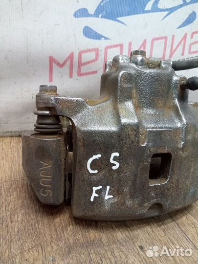 Суппорт тормозной передний левый Mitsubishi Lancer