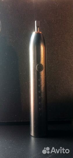 Электрическая зубная щетка