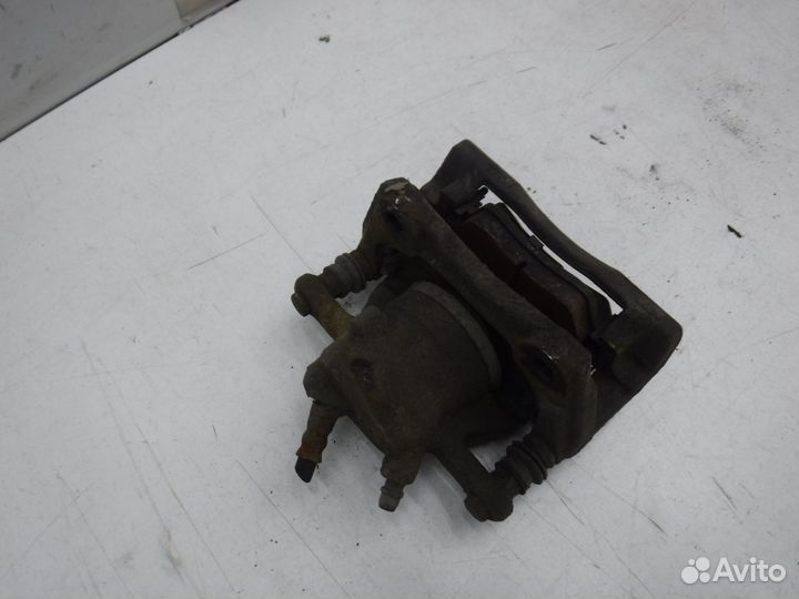 Суппорт тормозной передний левый Nissan Almera 201