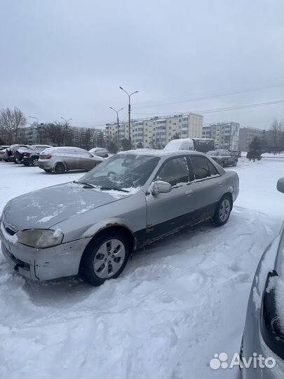 Mazda Familia 1.5 AT, 1999, 100 000 км