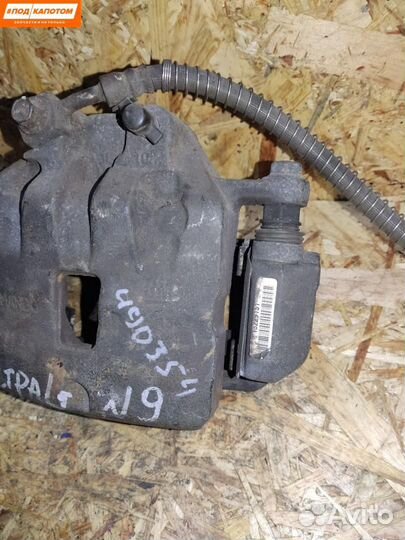 Суппорт тормозной передний левый Opel Astra J