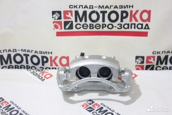 Суппорт тормозной передний левый Nissan Terrano