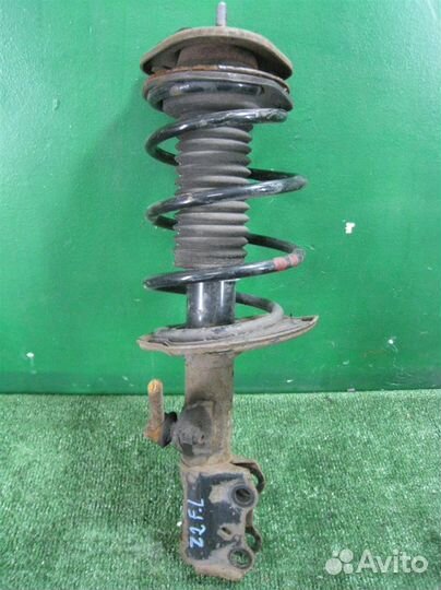 Стойка амортизатора передняя левая Toyota Auris E