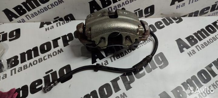 Суппорт тормозной передний левый Volkswagen Passat