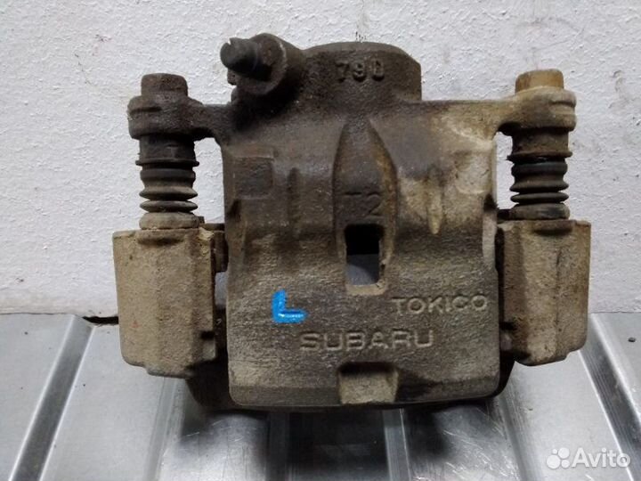 Суппорт задний задний левый Subaru Impreza