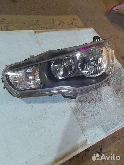 Фара левая Mitsubishi Lancer 10 1.8