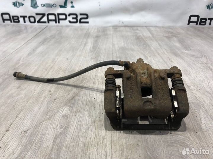 Суппорт тормозной задний правый Hyundai Tucson JM