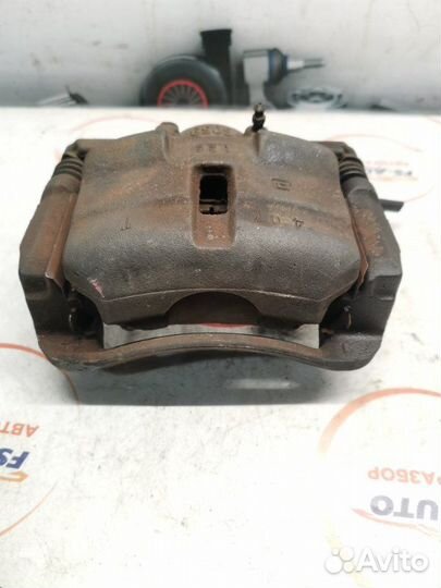 Суппорт тормозной передний левый Nissan Qashqai