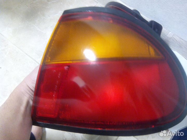 Фонари задние правы и левый Mazda 323 BA (1994—200