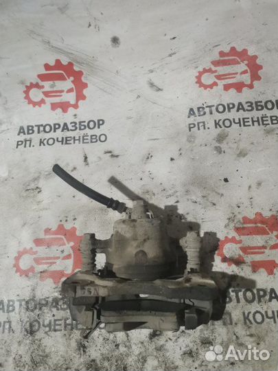 Суппорт тормозной передний левый Nissan Sunny