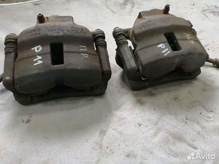 Суппорт тормозной передний для Nissan Primera P11E