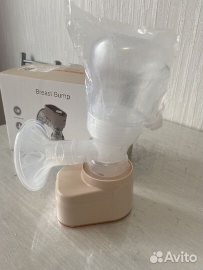 Молокоотсос электрический новый