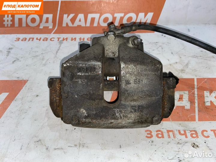 Суппорт тормозной передний левый Volkswagen Caddy