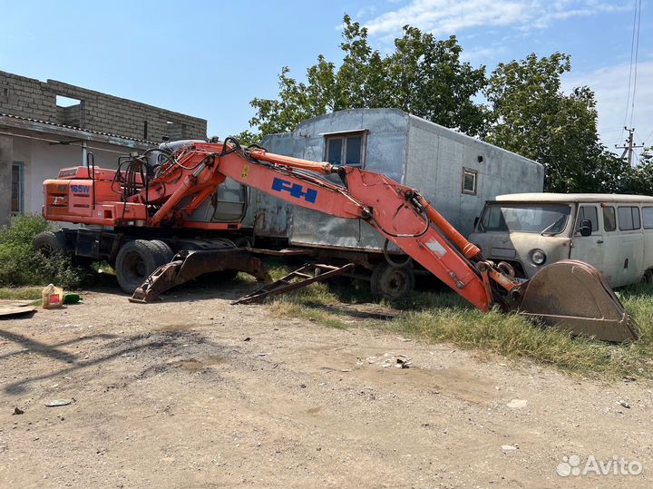 Колёсный экскаватор Hitachi EX165W, 2002