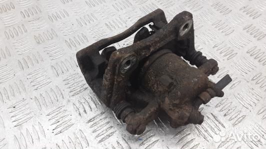 Суппорт тормозной передний левый nissan note E11