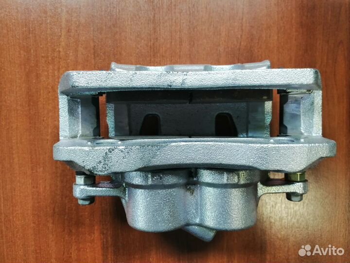 Передний левый суппорт на Газель Next