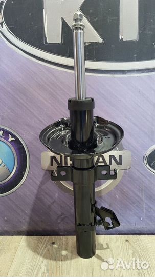 Амортизатор стойка перед Nissan X-trail T32 Лев