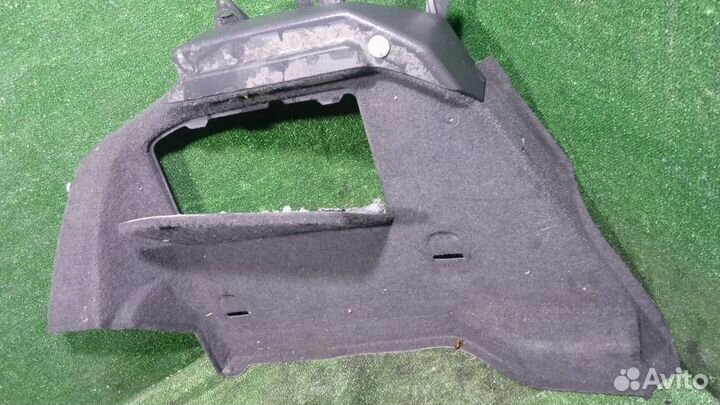 Обшивка багажника левая Opel Astra