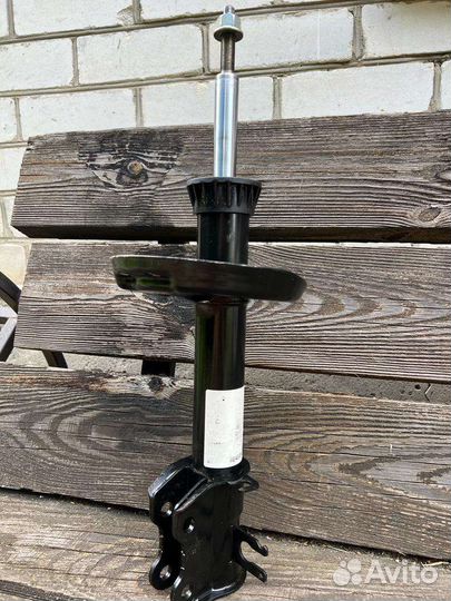 Амортизатор передний Опель Корса Д