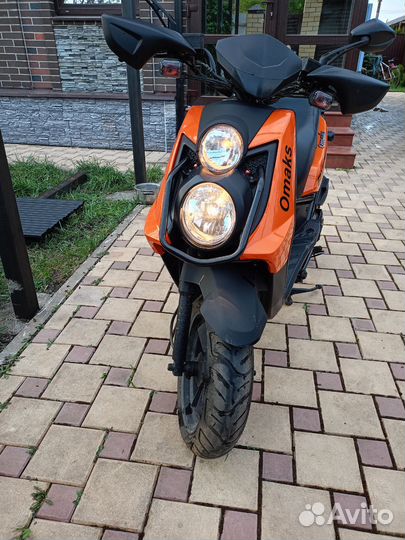 Новый максискутер