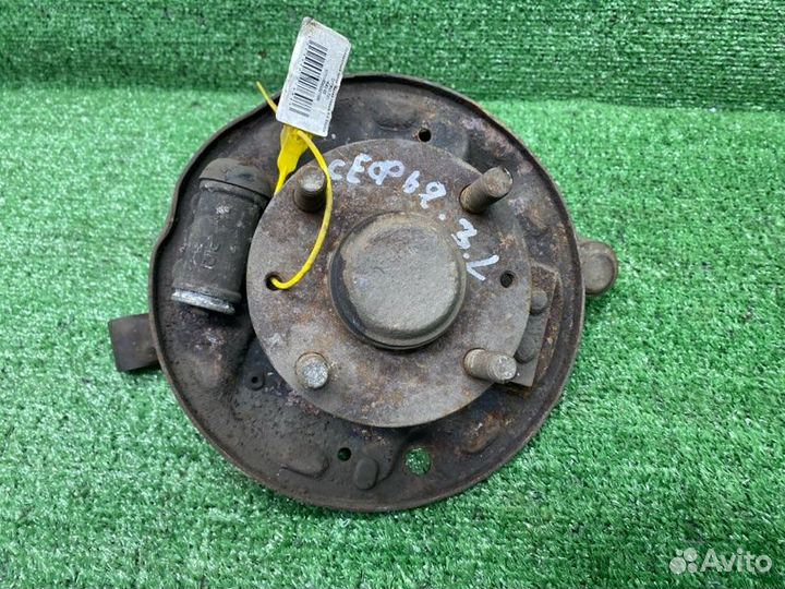 Поворотный кулак задний левый Kia Sephia