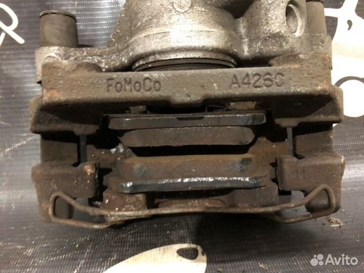 Суппорт тормозной задний левый Ford Focus 3